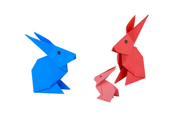 Three little rabbit made with small craft paper and nicely placed on a paper background