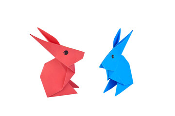 Two little rabbit made with small craft paper and nicely placed on a paper background