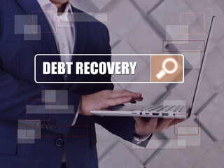  DEBT RECOVERY text in search line. Manager looking for something at computer.