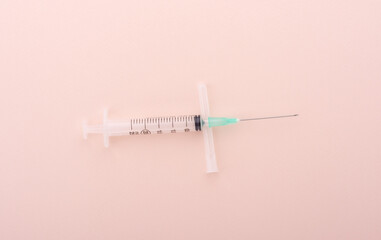 Plastic medical syringe 25 ml on the cap from the needle.
