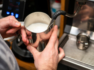 Fototapeta na wymiar frothing milk for making coffee