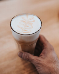 Professional barista makes cappuccino - morning in a coffee shop
