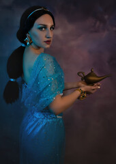 Beautiful Jasmine princess closeup with magic lamp in her hands. Art photo