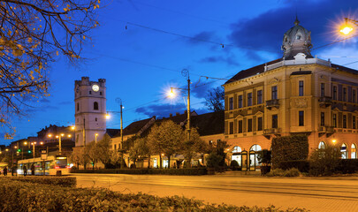 Cityscape of Debrecen streets with Small Reformed Church in night lights, Hungary