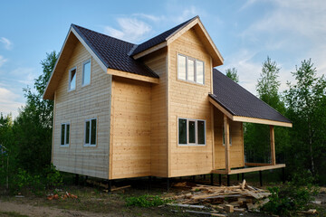 Fototapeta na wymiar Moscow region, Russia - 05.27.2021: a new wooden house just built in contryside