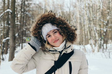 sunny girl in the snowy forest