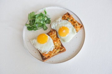 scrambled eggs toast melted cheese cilantro plate