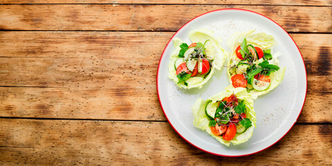 Spring vegetable salad on wooden table,summer food