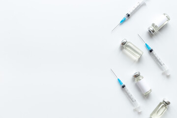 Vaccination with Covid vaccine in bottles with syringe