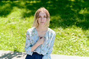 Outdoors portrait of beautiful young woman with green eyes.