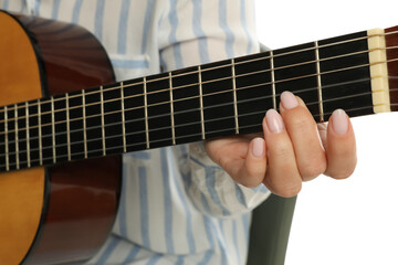 Music teacher playing acoustic guitar, closeup view