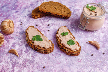 Fresh homemade chicken (duck,goose,rabbit,turkey) liver pate on whole grain bread with seeds.