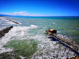 Overflow of the Adriatic sea of Termoli, Campobasso, Molise, Italy under a blue cloudless s - obrazy, fototapety, plakaty