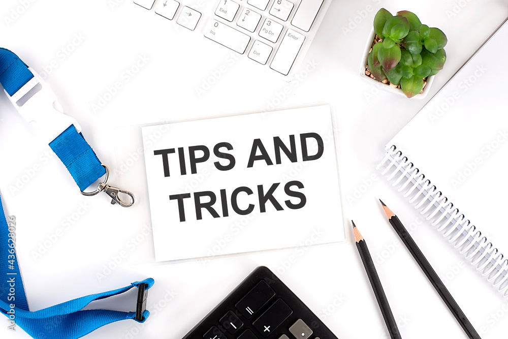 Poster tips and tricks words on card with keyboard and office tools