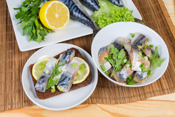 Smoked Atlantic mackerel slices and open sandwich with salted  mackerel