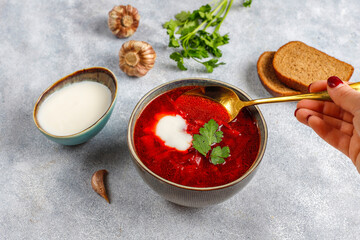 Traditional Ukrainian Russian borscht or red beetroot soup in the bowl.