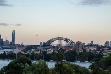 Sydney city skyline at sunset with the famous Sydney Harbour Bridge