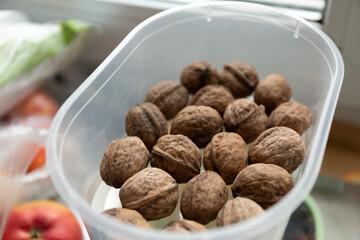 Close up of walnuts on a kitchen table in a container