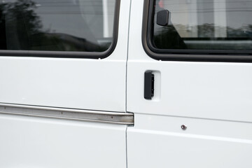 White metal door of a minibus. - 436630479