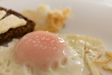 close-up of fried eggs in a pan