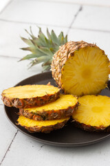 Ripe juicy pineapple cut into rings close-up