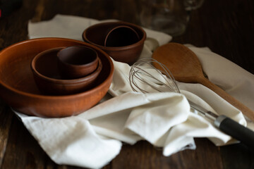 earthenware close-up on a wooden table with a white napkin