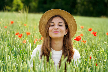 Beautiful girl comes out from fields deep breathing. Woman rebirth.