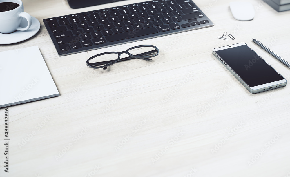 Poster work place with black keyboard, glasses and modern smartphone on light wooden concrete surface with 