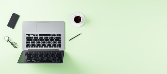 Work place with modern laptop, smartphone and coffee cup on blank ight green surface background. Mockup