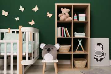 Beautiful baby room interior with stylish furniture and comfortable crib