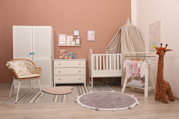 Baby room interior with stylish furniture and comfortable crib © New Africa