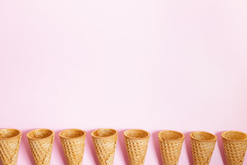 Ice cream cones on pink color background.