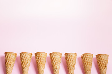 Ice cream cones on pink color background.