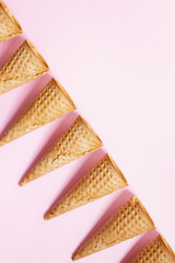 Ice cream cones on pink color background.