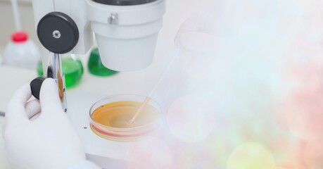 Composition of scientist using microscope in laboratory and copy space