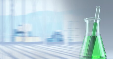 Composition of conical flask of green liquid and stirrer, with blurred background copy space