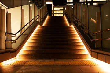 Illuminated stairs in the city at night.