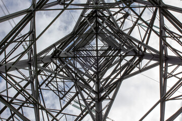 Underneath High Voltage Pylon Tower - stock photo
