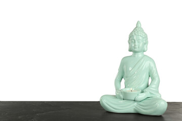 Beautiful ceramic Buddha sculpture with burning candle on table against grey background. Space for text