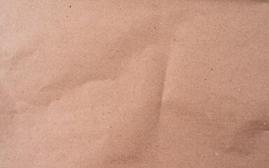 Recycled crumpled beige paper texture or background for design with copy space