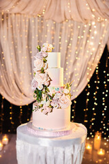 Luxury wedding cake on restaurant interior background
