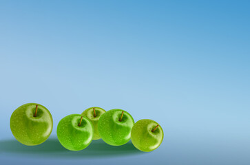  A composition of green apples on a colored background, a banner, a postcard.