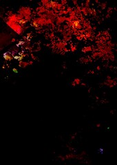 暗闇に光る赤い血の幻想的なテクスチャ背景