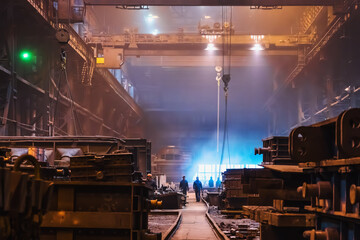 Long huge workshop or hangar in metallurgical plant, foundry manufacturing, heavy industry.