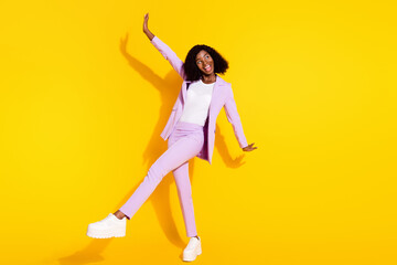 Fototapeta na wymiar Full size photo of young happy smiling funky funny afro woman dancing enjoy weekend isolated on yellow color background
