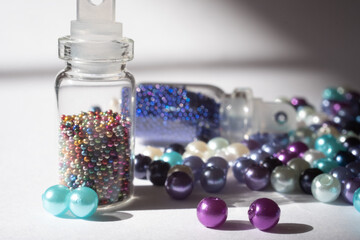 beads and bottles on a white background