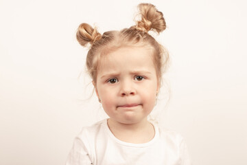 Little cute girl on the light background