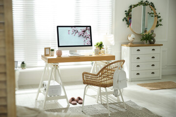 Stylish home office interior with comfortable workplace