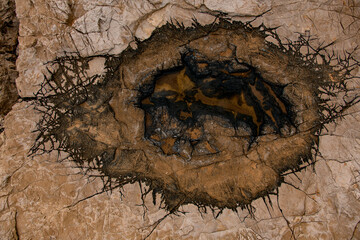 texture of old stone with incredible pattern of cracks on the surface.
