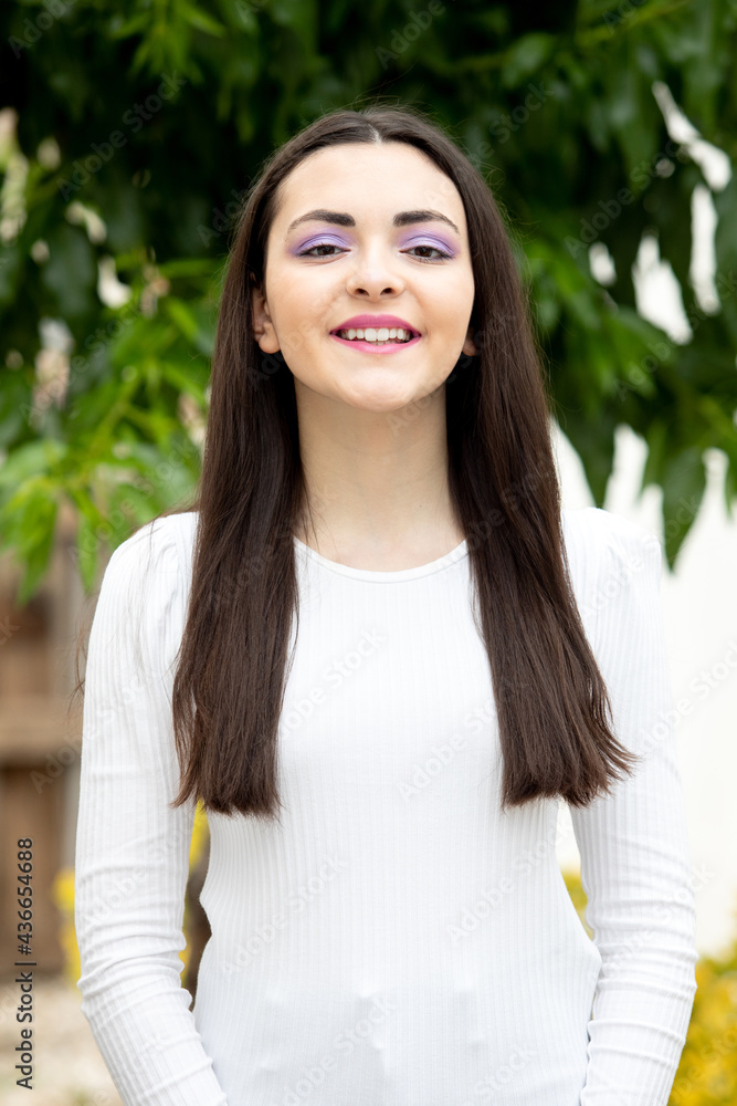 Wall mural cute young woman with purple eyeshadow